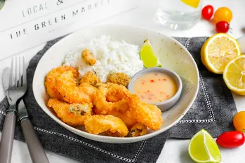 Pattaya seafood recipe in coconut breading with white rice and spicy pineapple sauce